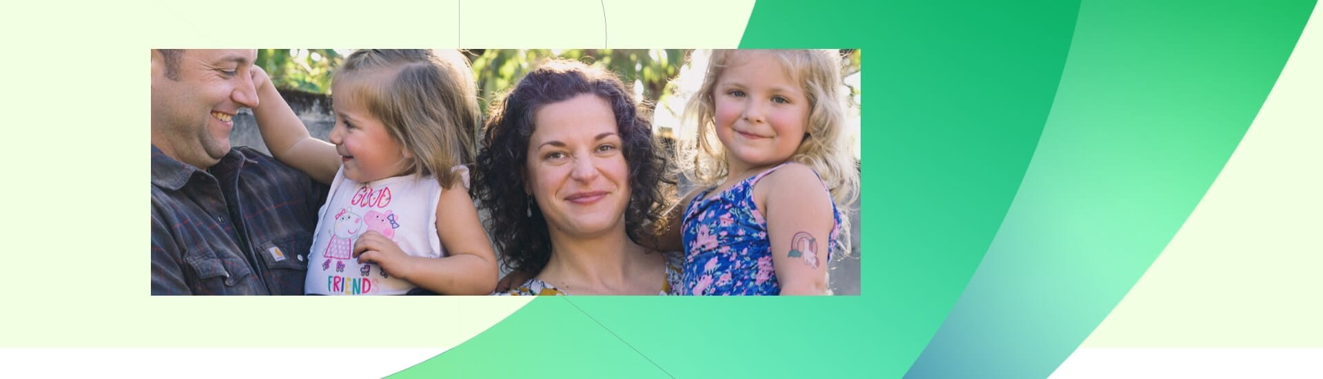 family holding daughters