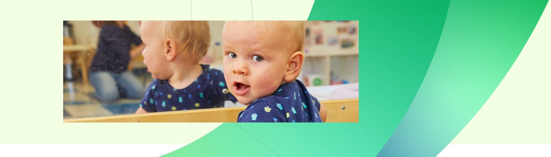 baby looking in mirror