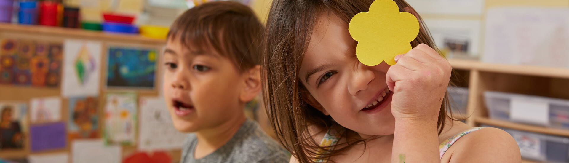 girl playing with flower