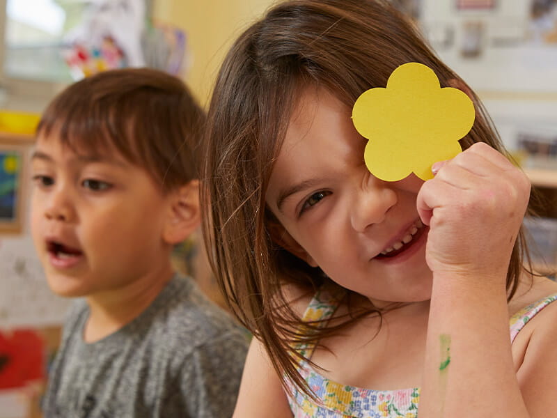 kids playing with flower