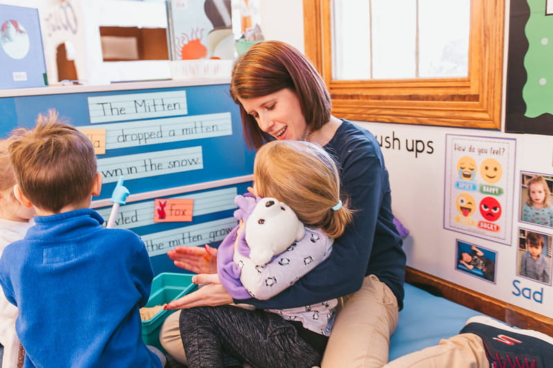 Teacher in a small group setting with children