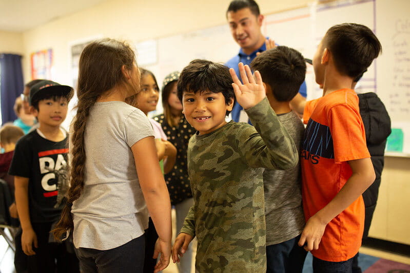 boy waving