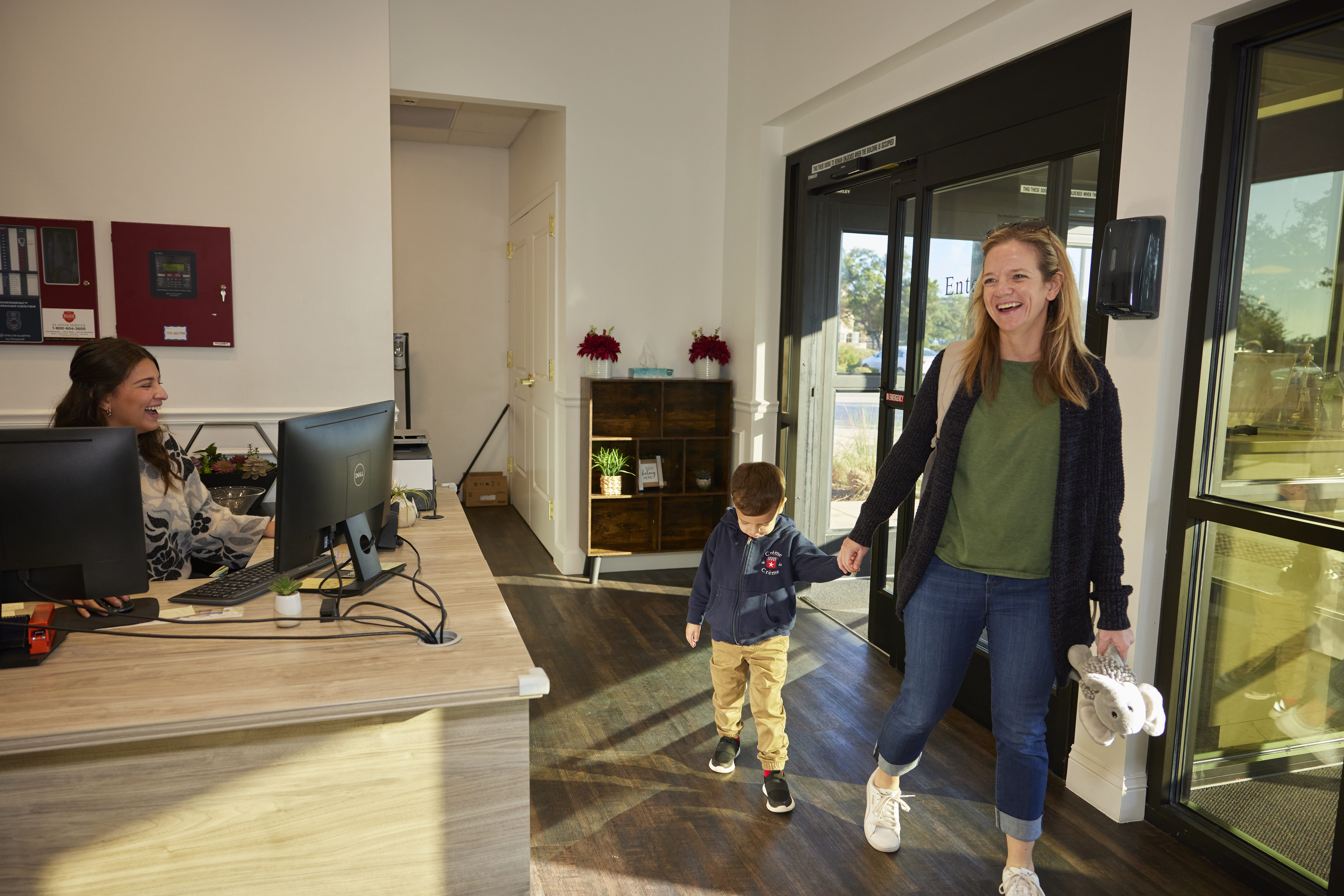 Mother dropping son off at child care center