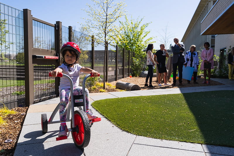 Child riding bike outside