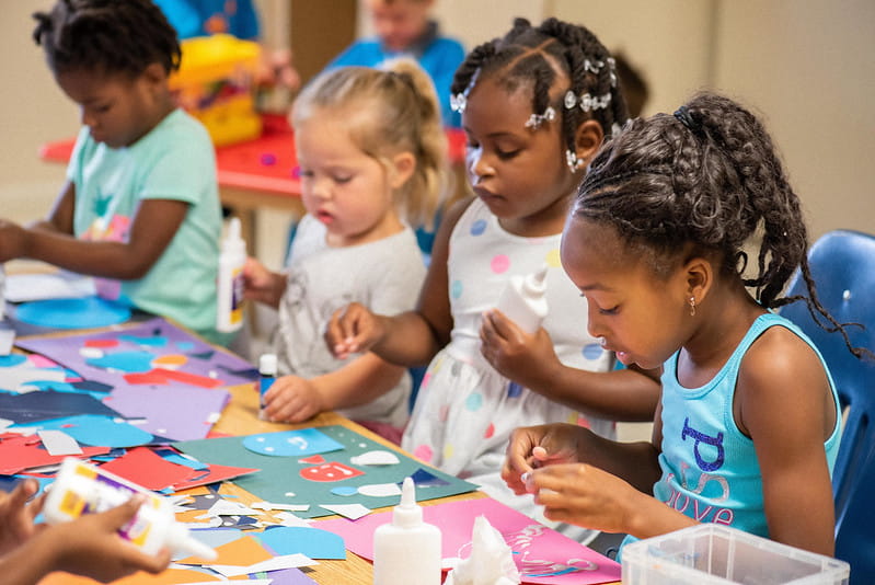 four girls making crafts