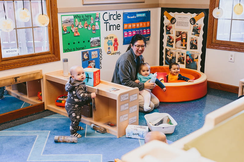 Infants playing with teacher