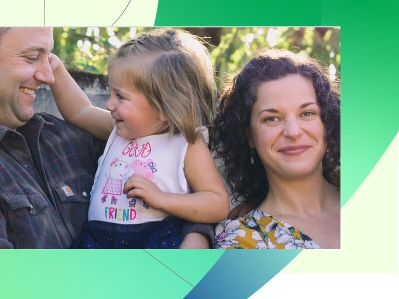 Family holding daughter